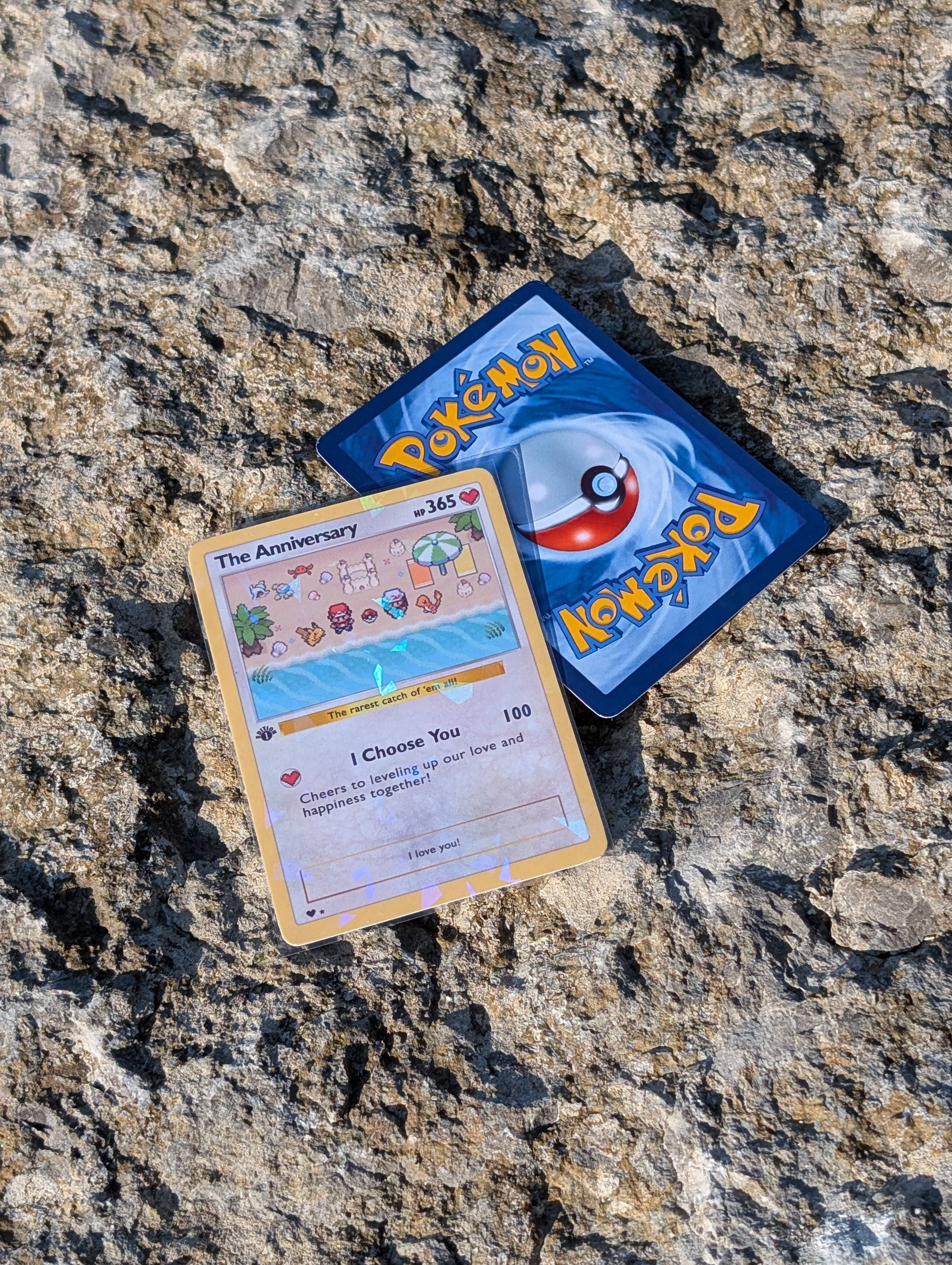 Two trading cards on a textured stone surface